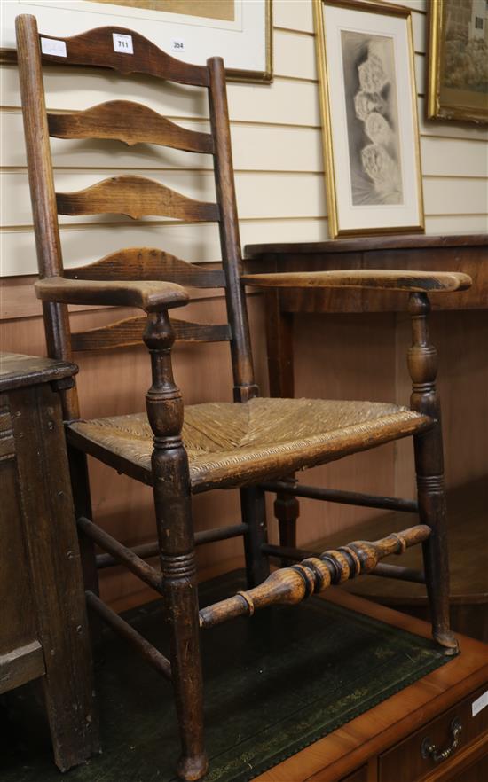 A County rush seat ladderback elbow chair, and two others